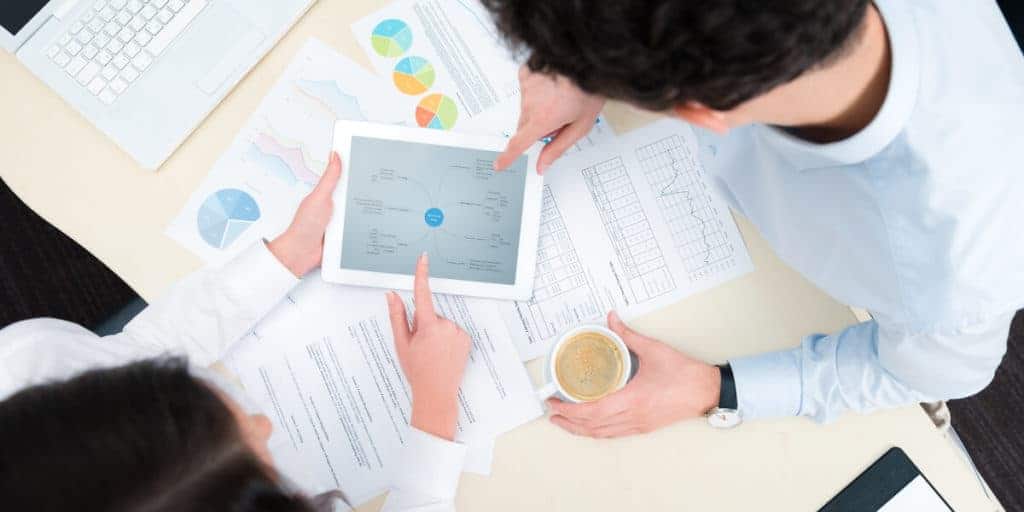 man and woman creating business plan