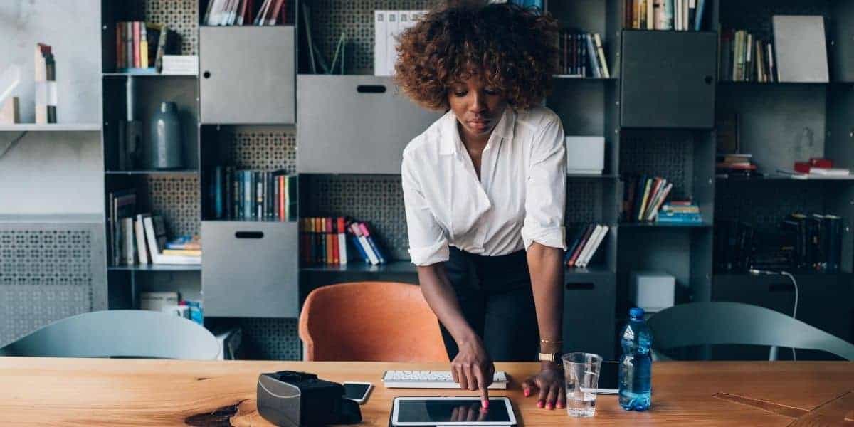 Executive using ipad in office