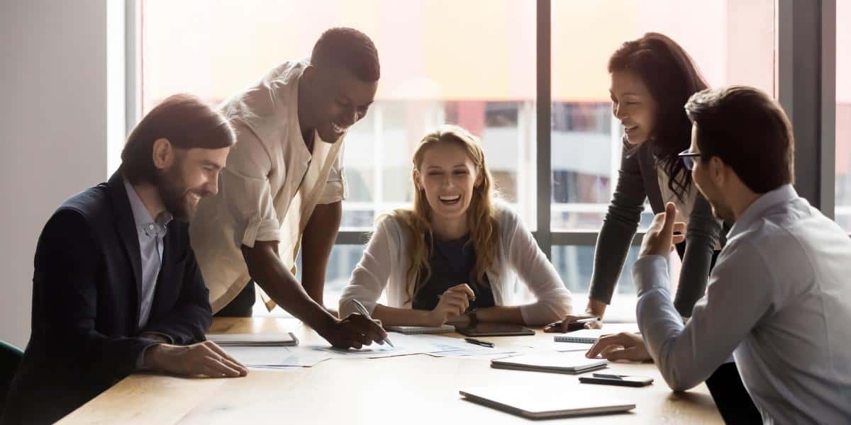 Employees engaging in meeting