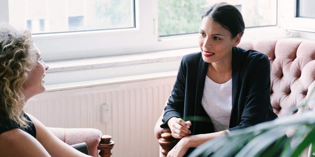 Internal coach with coachee at the office