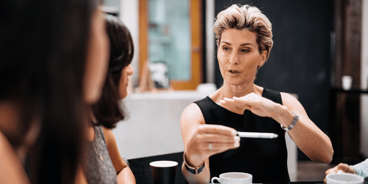 organization leader using expertise in front of team