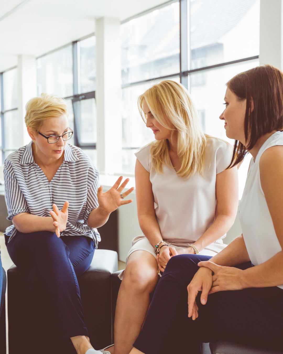 Corry Robertson sitting on a desk at home