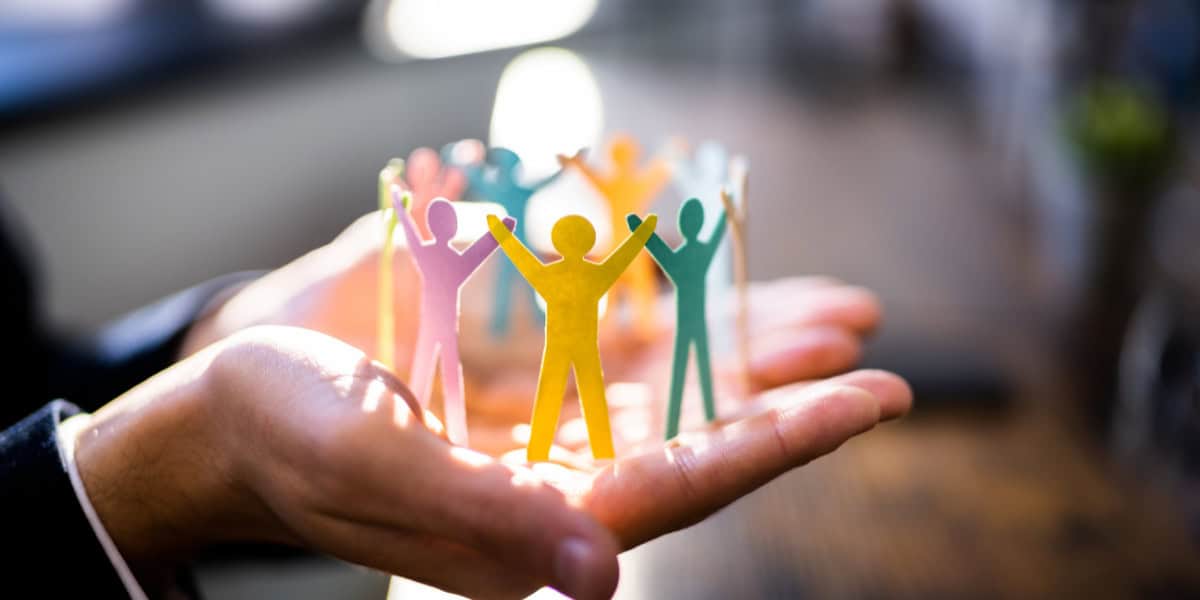 Paper cutouts of people in the a circle