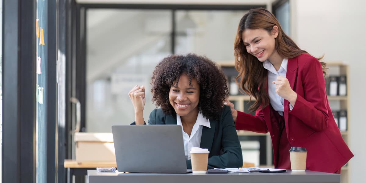 Coaches smiling and celebrating
